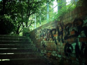 A photograph of graffiti on brick in Berlin.