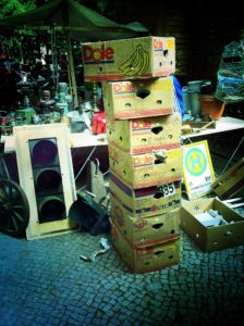 A photograph of several banana boxes being packed up.