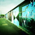 A photograph of graffiti on the western side of the Berlin wall.