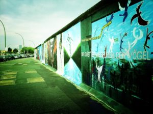 A photograph of graffiti on the western side of the Berlin wall.